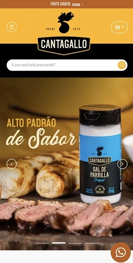 Home da loja da Cantagallo no celular: cabeçalho amarelo com a marca e a busca, e o banner “Alto padrão de sabor” com o pote de Sal de Parrilla sobre uma tábua de carne.