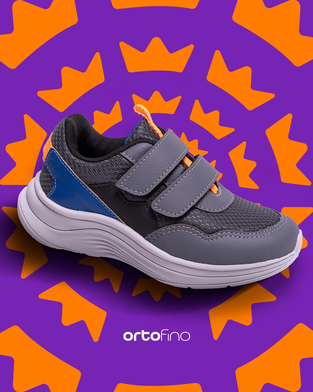 Post da Ortofino: tênis esportivo infantil cinza e azul com velcro, sobre fundo roxo com o padrão de coroas laranja.
