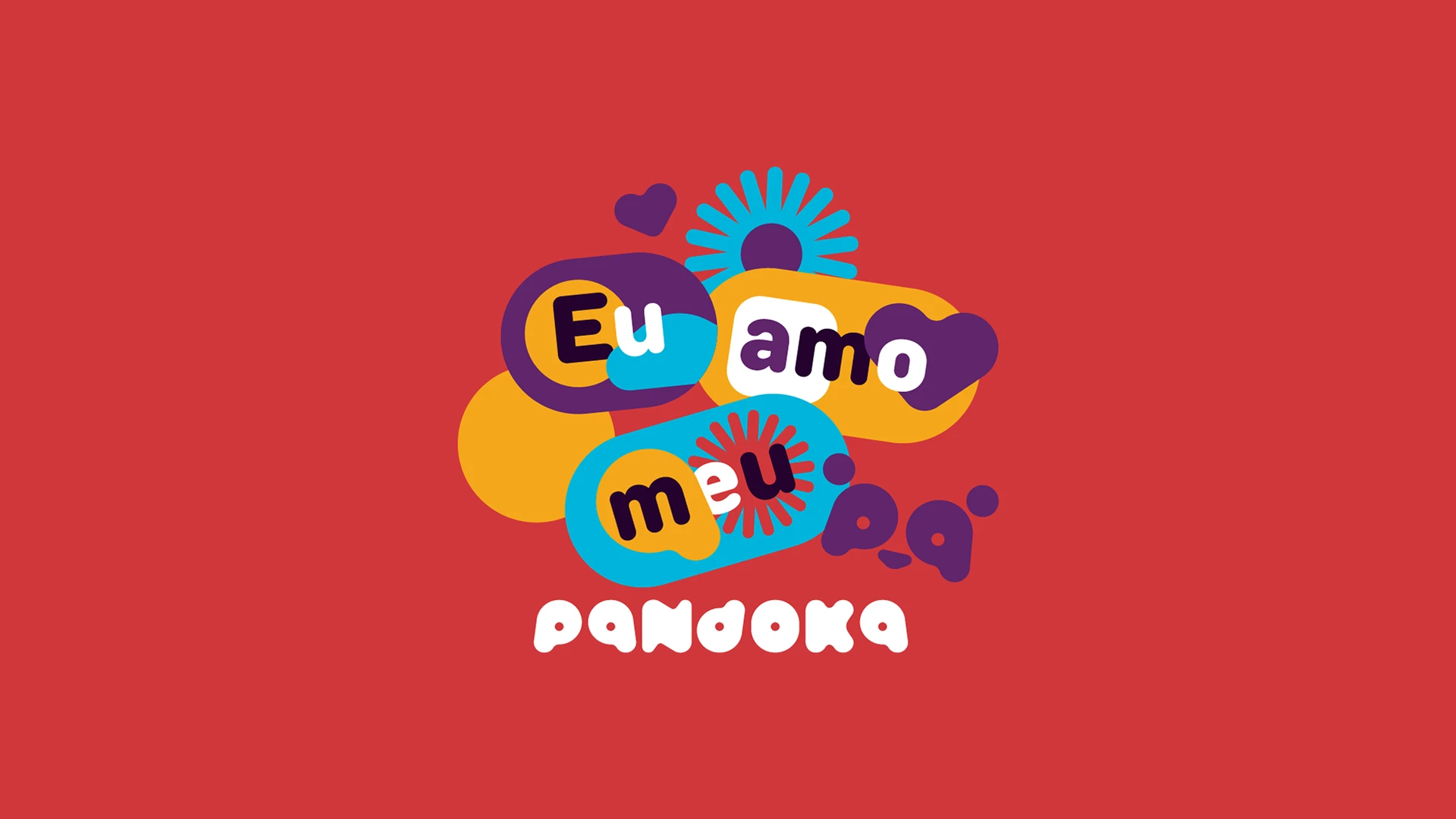 O selo “Eu amo meu pa” da Pandoka: as palavras em balões azul, amarelo e roxo, com corações e explosões, sobre fundo vermelho, e a assinatura pandoka em branco embaixo.